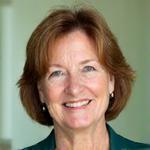 Professional headshot of Elara Vance, a compassionate wellness coach